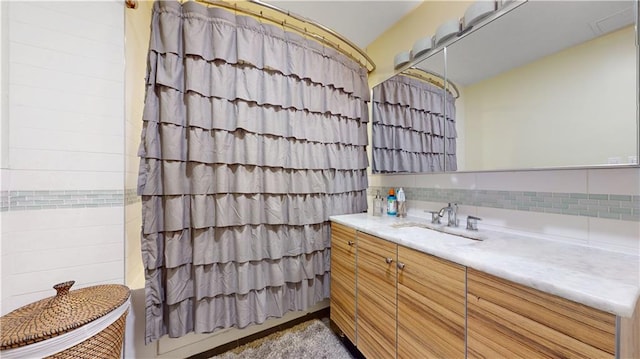 bathroom with backsplash and vanity