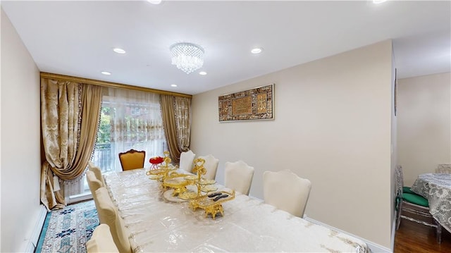 dining area featuring a notable chandelier and recessed lighting