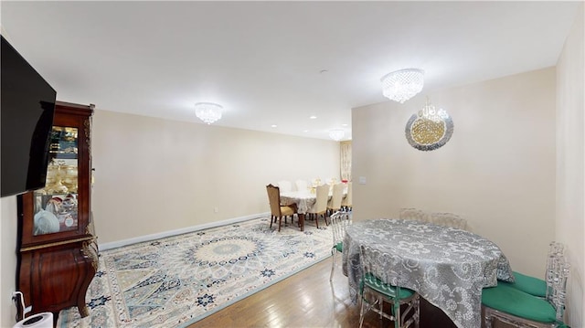 dining area with wood finished floors