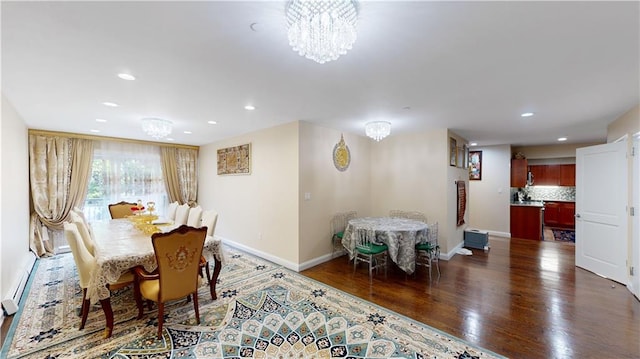 dining area featuring a chandelier, dark wood-type flooring, recessed lighting, and baseboards