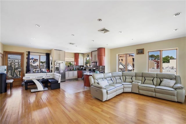 living room with light hardwood / wood-style floors