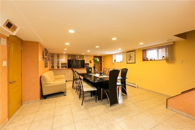 dining space featuring baseboard heating