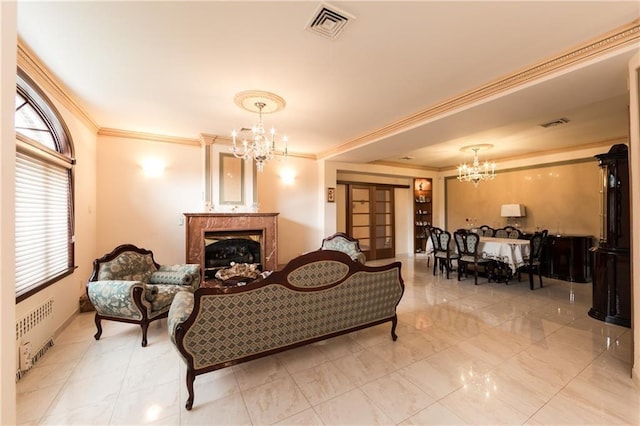 living room with crown molding, a high end fireplace, radiator heating unit, and a notable chandelier