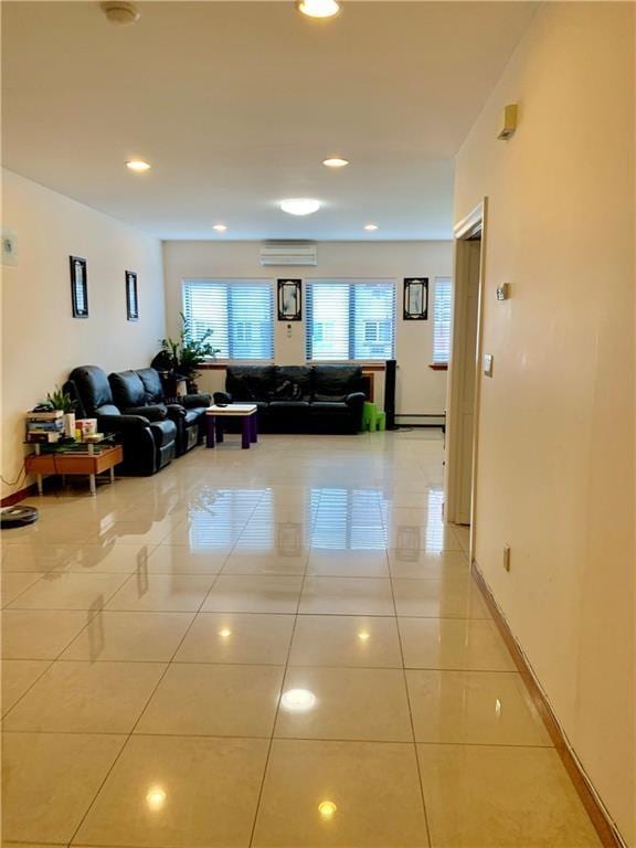 interior space featuring an AC wall unit and a baseboard heating unit