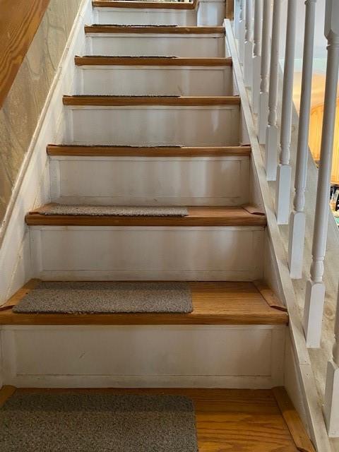 stairs with wood finished floors