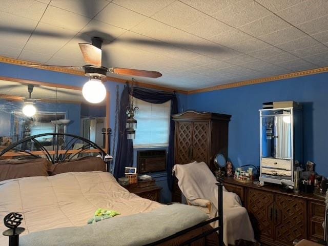 bedroom with cooling unit and ceiling fan