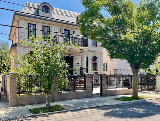 view of front of house with a balcony