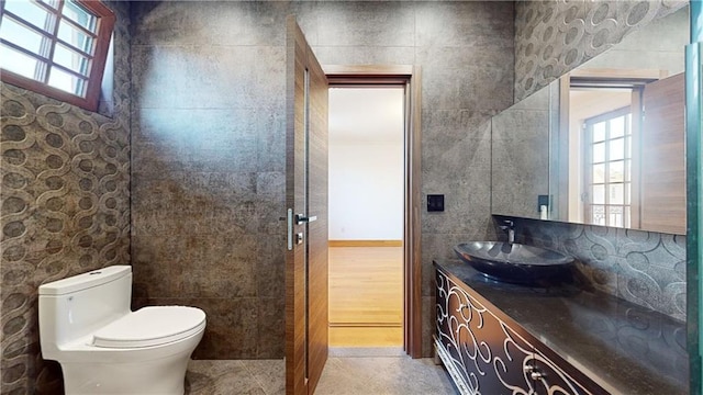 bathroom with tile patterned flooring, vanity, and toilet