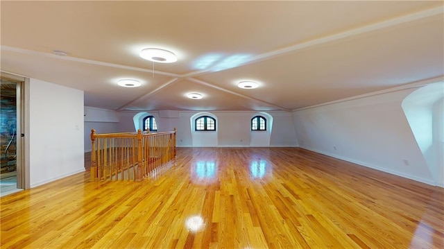 bonus room with light wood-type flooring