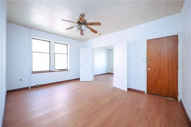 empty room with light wood-type flooring and ceiling fan