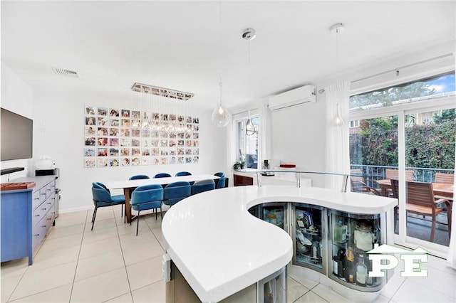 tiled dining area with a wealth of natural light and a wall mounted AC