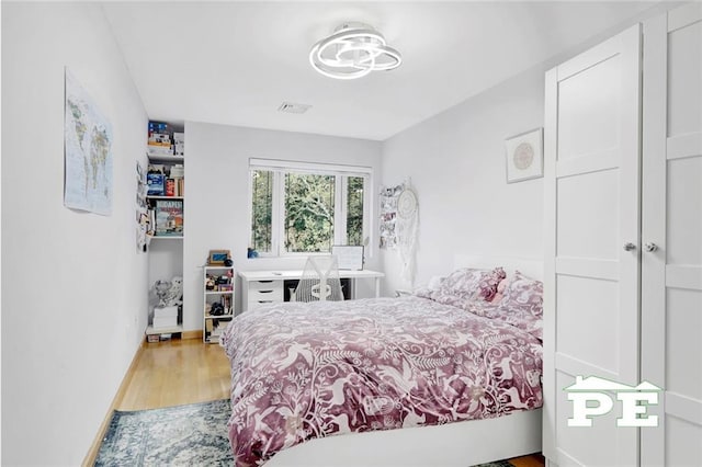 bedroom featuring light hardwood / wood-style flooring