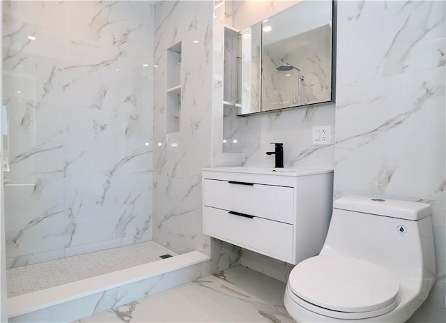 full bath with toilet, marble finish floor, a marble finish shower, and vanity