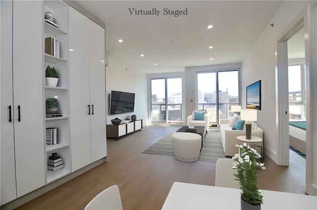 9964 3rd Ave Unit 5A, Brooklyn, NY 11209 - living room with built in shelves, light wood-style floors, and recessed lighting
