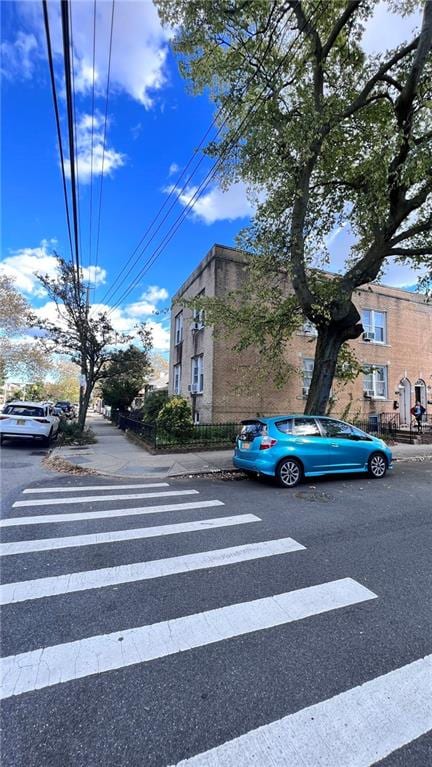 view of road with curbs and sidewalks