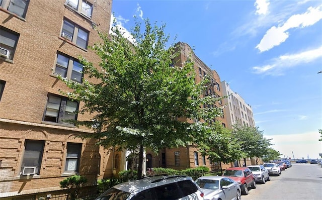 view of building exterior with cooling unit