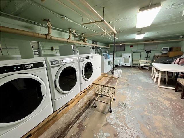 clothes washing area featuring washing machine and dryer