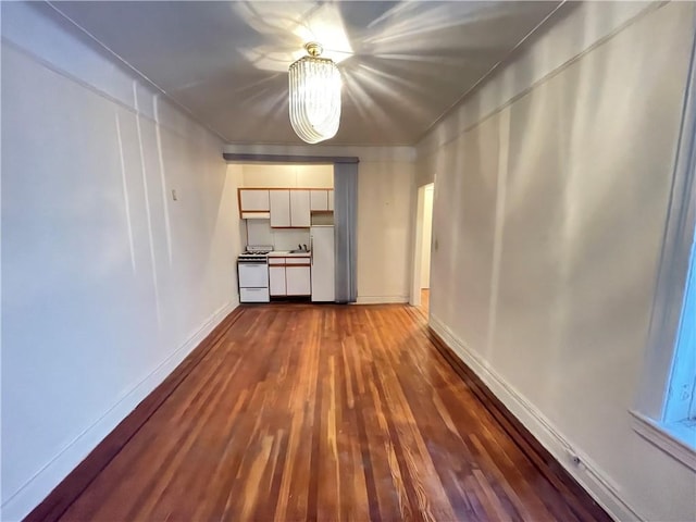 unfurnished living room featuring dark hardwood / wood-style floors