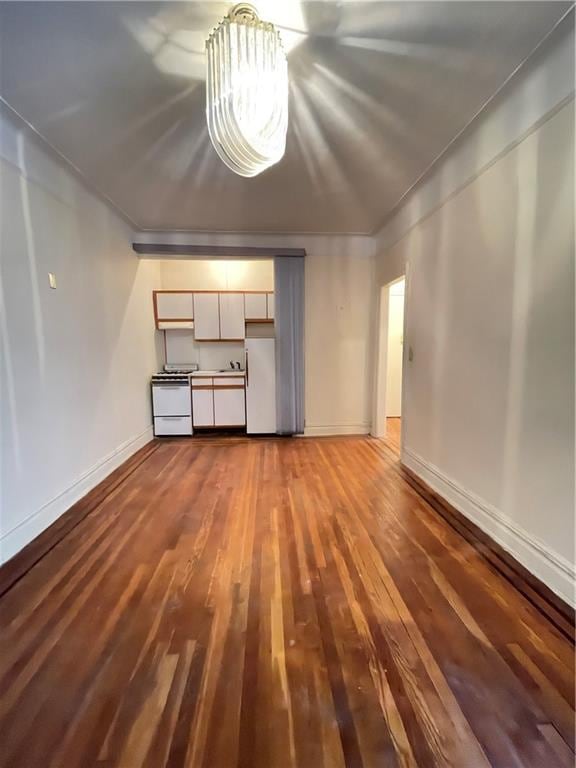 unfurnished living room featuring wood-type flooring