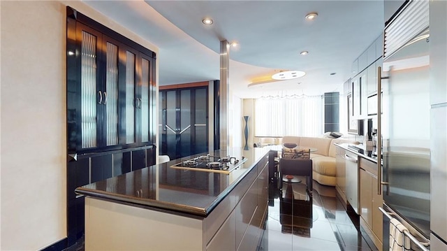 kitchen featuring tile patterned floors, a center island, and appliances with stainless steel finishes