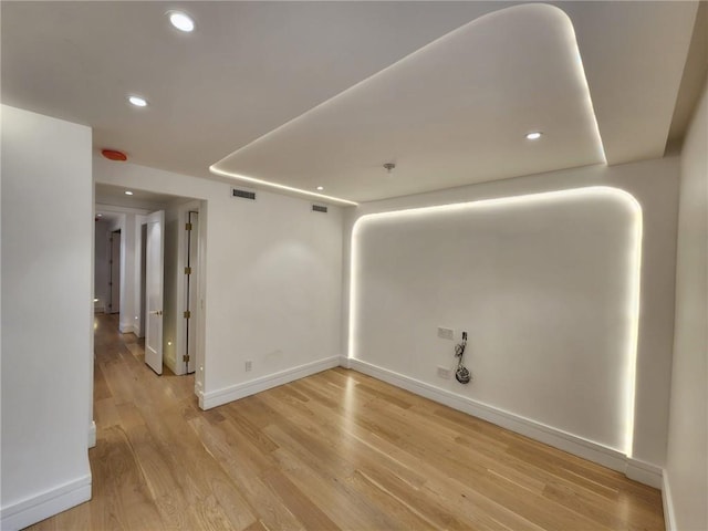 unfurnished room featuring light hardwood / wood-style floors