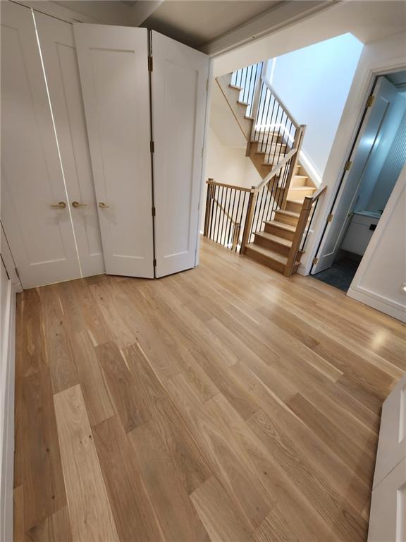 interior space featuring a closet and light hardwood / wood-style flooring