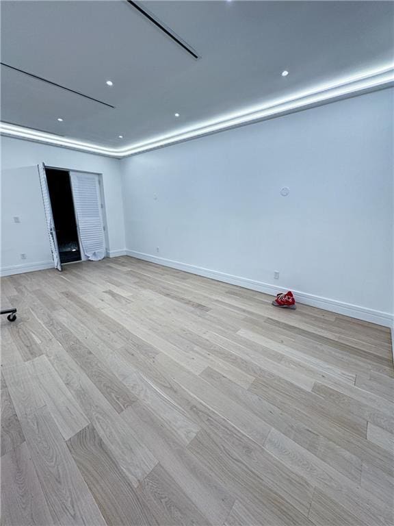 unfurnished room with light hardwood / wood-style flooring