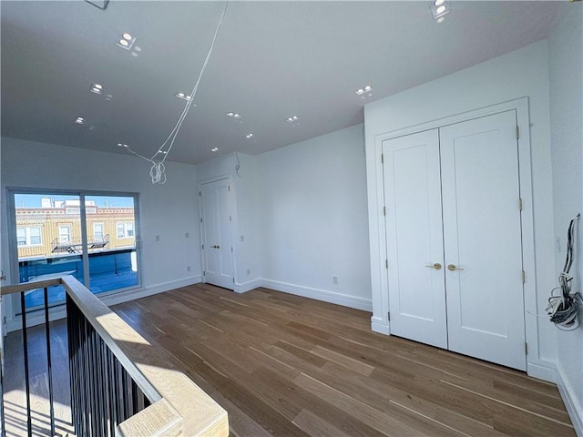 spare room featuring dark hardwood / wood-style flooring