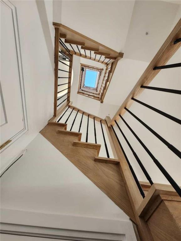 staircase with a skylight