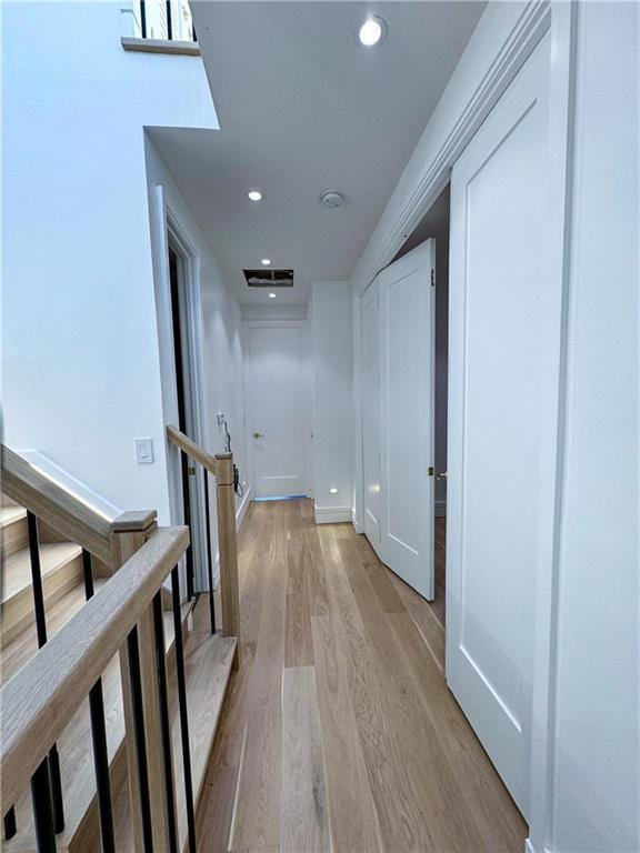 hallway featuring light hardwood / wood-style flooring