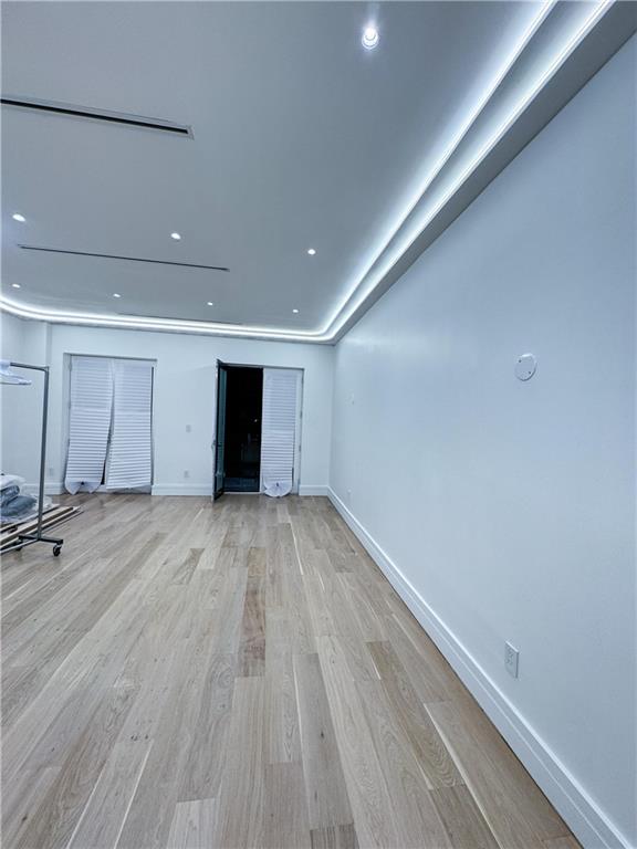 unfurnished living room featuring light hardwood / wood-style floors