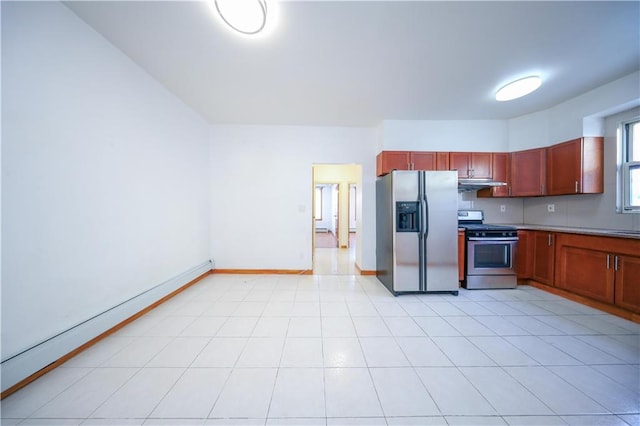 kitchen with light tile patterned floors, stainless steel appliances, and a baseboard heating unit