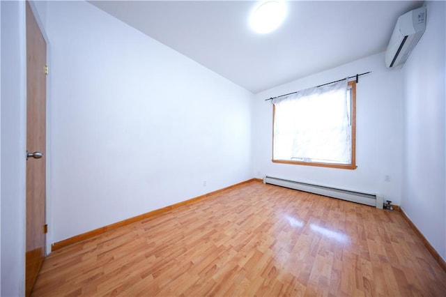 empty room featuring light wood-type flooring, lofted ceiling, a wall mounted air conditioner, and baseboard heating