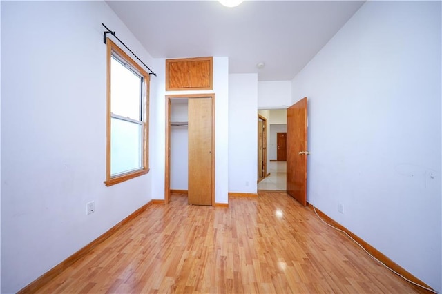 unfurnished bedroom featuring light hardwood / wood-style flooring