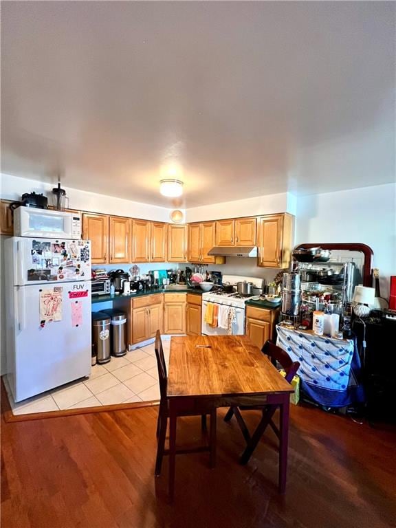 dining space with light tile floors