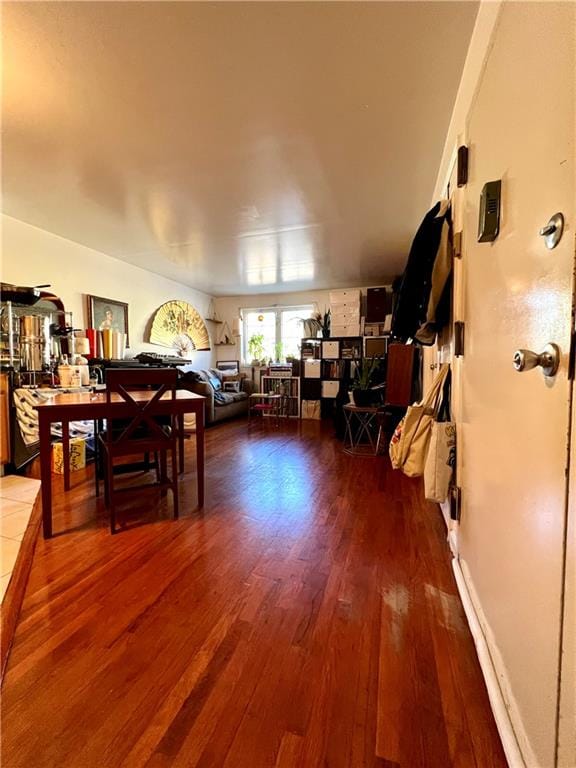 dining space with hardwood / wood-style floors