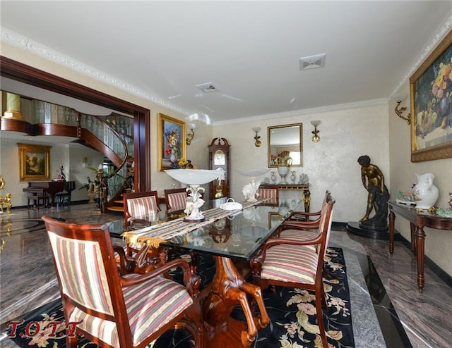 dining space with ornamental molding