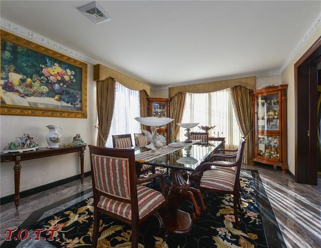 dining room with crown molding