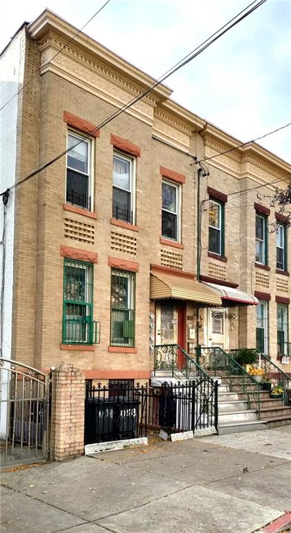 1434 65th St, Brooklyn, NY 11219 - view of building exterior featuring a fenced front yard