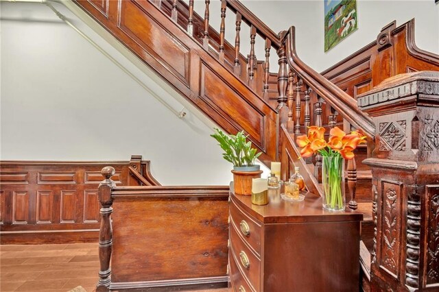 stairs featuring wood-type flooring