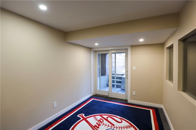 interior space featuring recessed lighting and baseboards