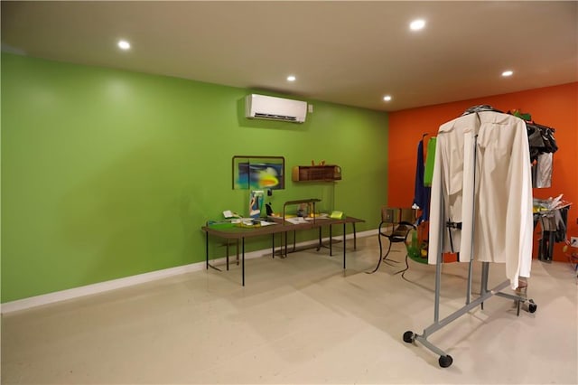 home office with an AC wall unit, recessed lighting, baseboards, and finished concrete floors