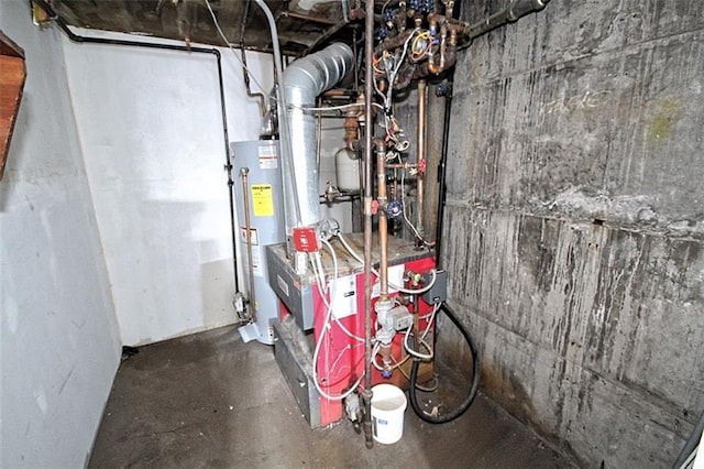 utility room featuring gas water heater