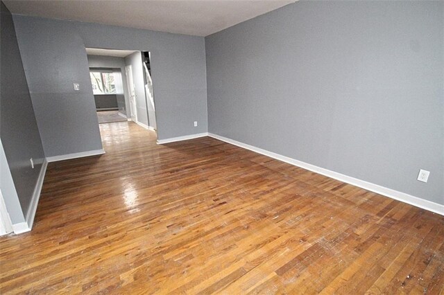 unfurnished room featuring hardwood / wood-style floors