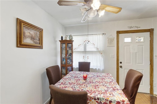 dining area with a ceiling fan