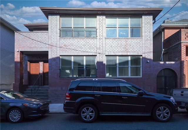 view of front facade featuring brick siding