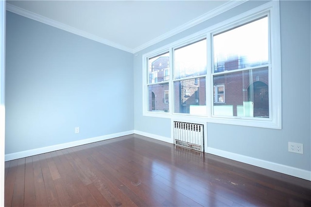 unfurnished room featuring radiator heating unit, baseboards, dark wood-style flooring, and ornamental molding