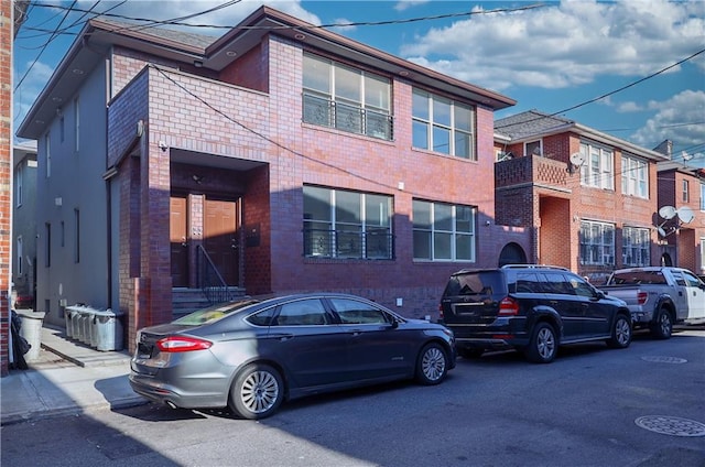 view of front of property featuring brick siding