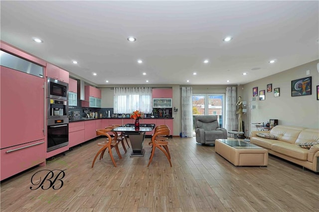 kitchen featuring light wood-type flooring and built in appliances