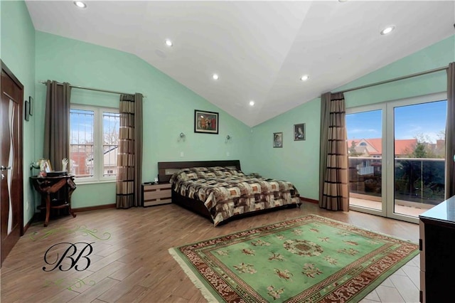 bedroom with access to exterior, light hardwood / wood-style flooring, and lofted ceiling